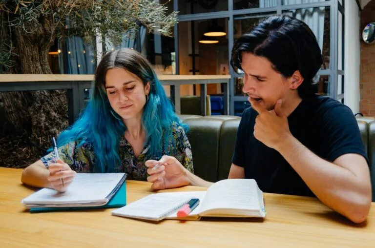 An author and an editor going through the draft together